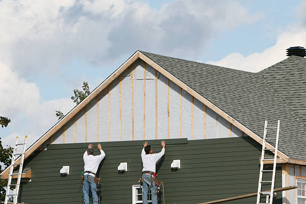 Professional Storm Damage Siding Repair technician working in Barco, NC